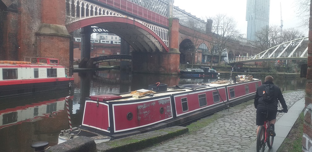 Canals, railways and cyclists meet
        <br>on the site of Manchester